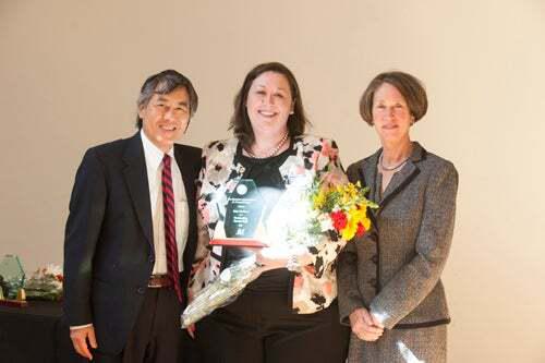 Erin McClure, the 2013 award winner for outstanding exempt staff.