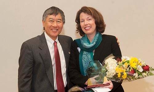 Page Elizabeth Smith, the 2014 award winner for outstanding exempt staff with President Loh.